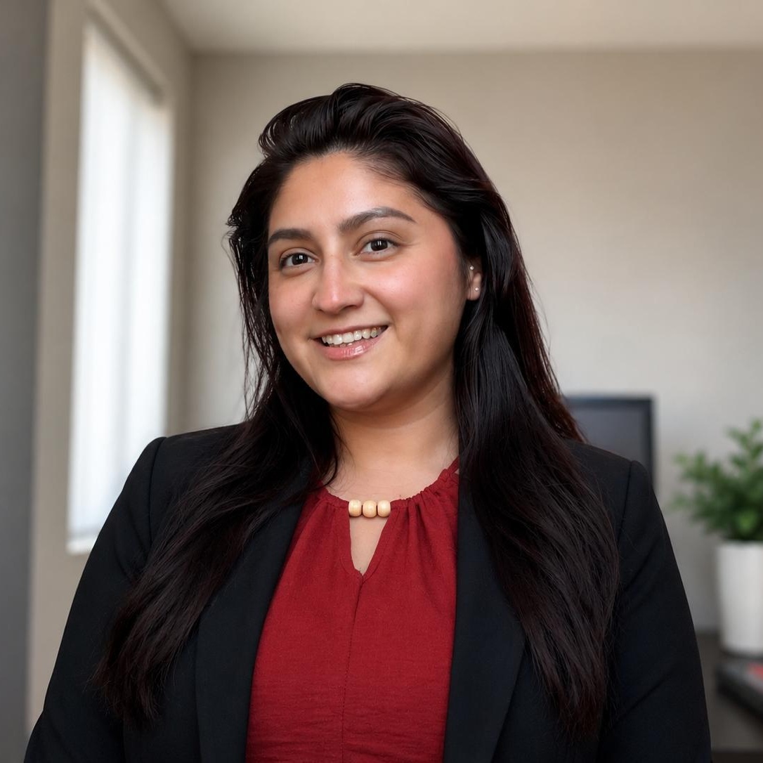 Sandra Leiva, USG Law Group senior paralegal, wearing a red top and black blazer