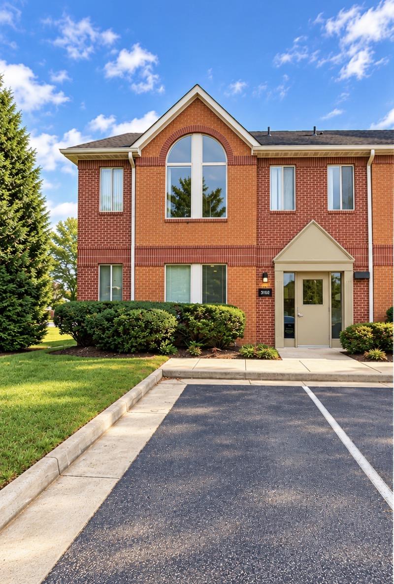 Brick exterior and entrance of the USG Law Group office building at 3102 Golansky Boulevard in Woodbridge, Virginia